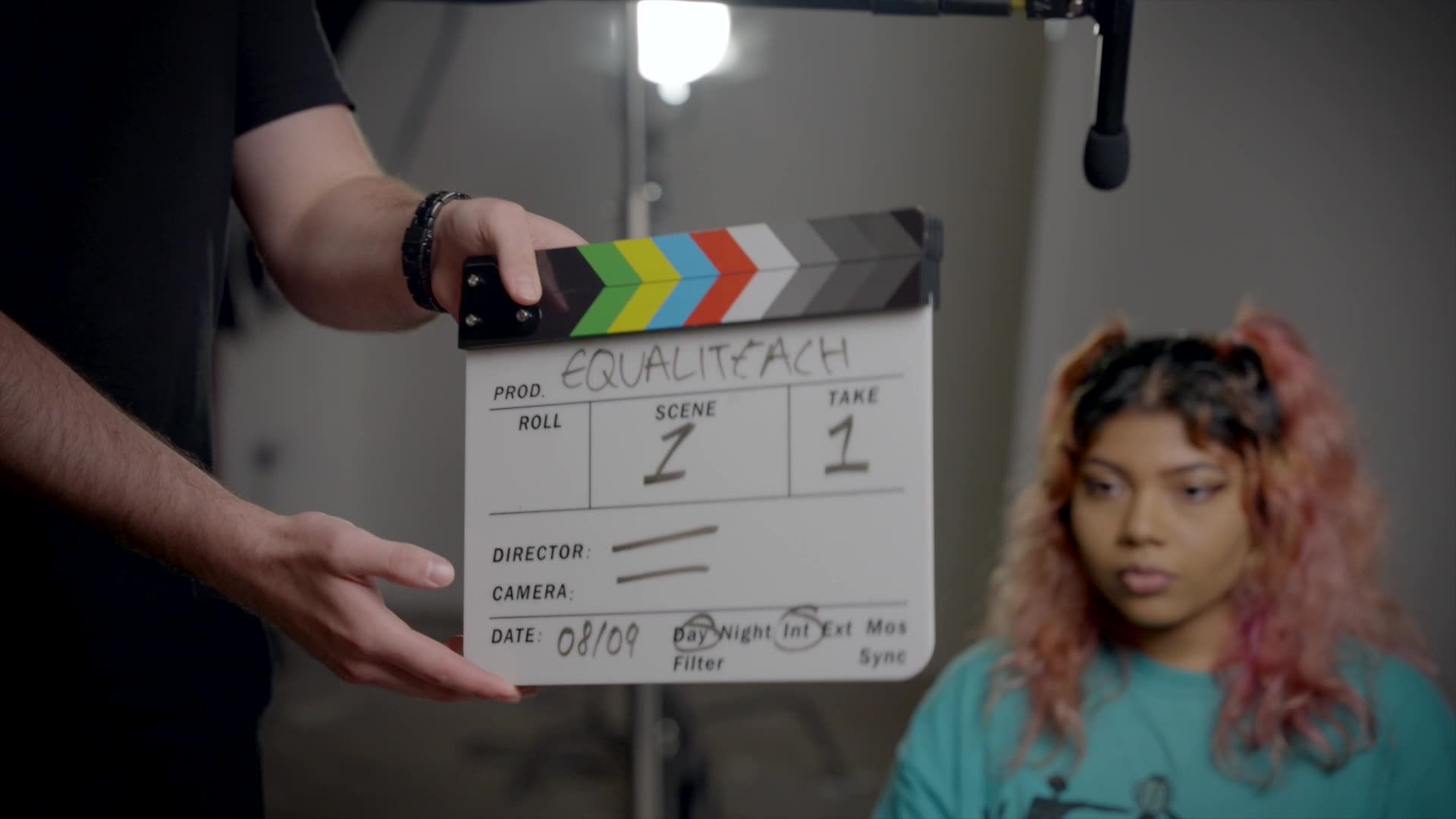 behind-the-scenes clapper woman interview