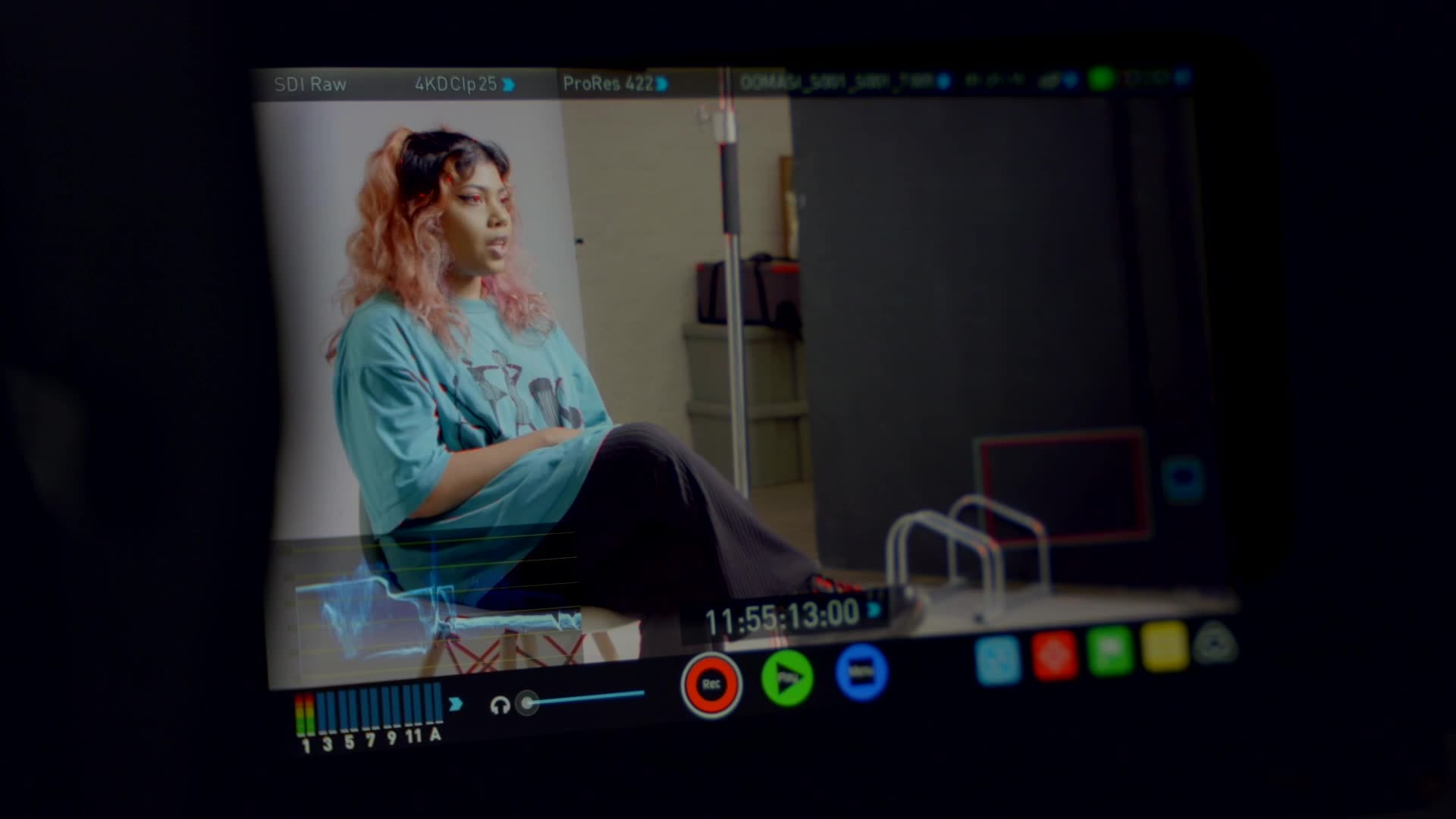 behind-the-scenes monitor woman interview studio