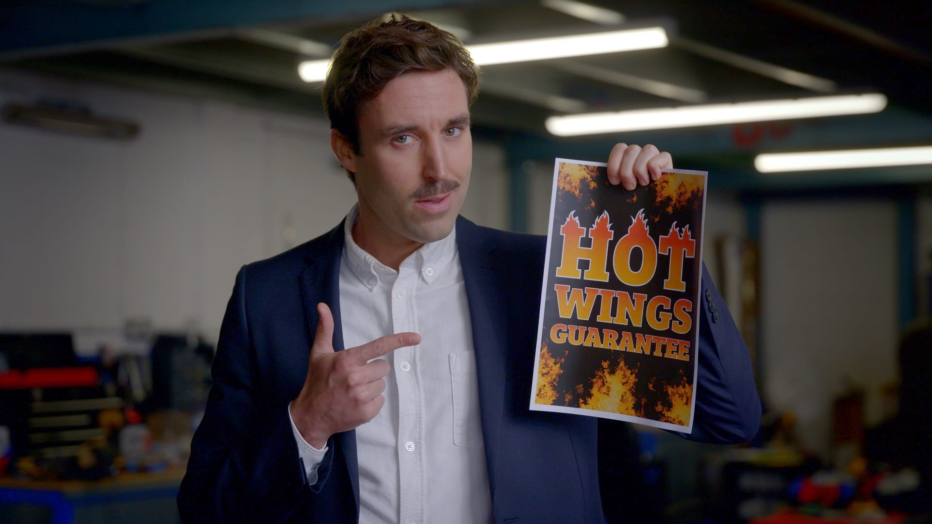 man pointing suit hot wings moustache