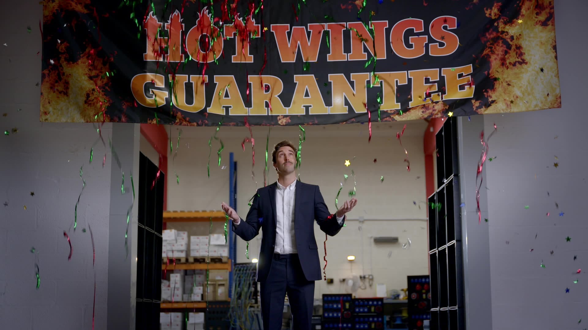 celebrate man blue suit confetti