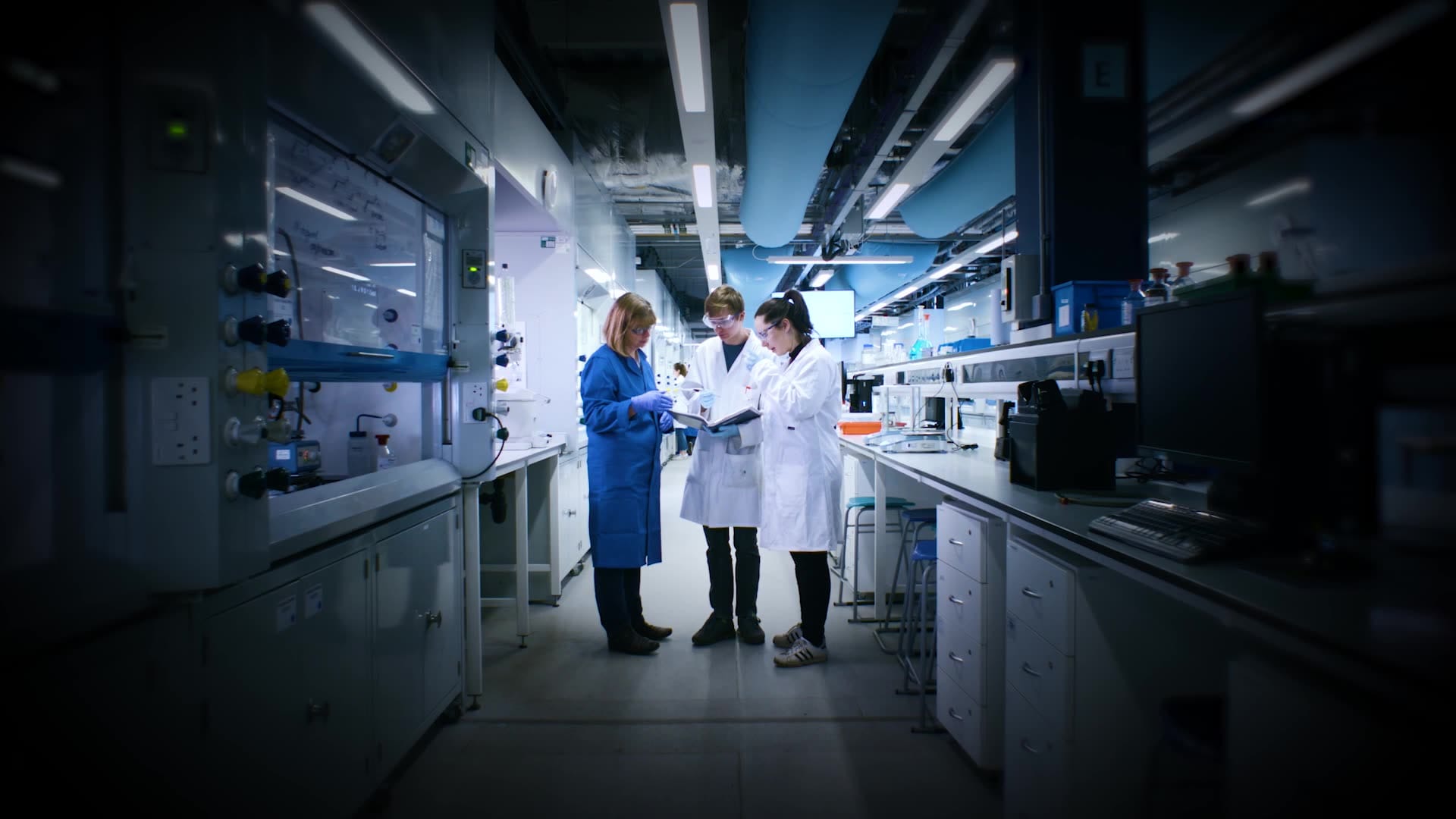 man woman science lab coats