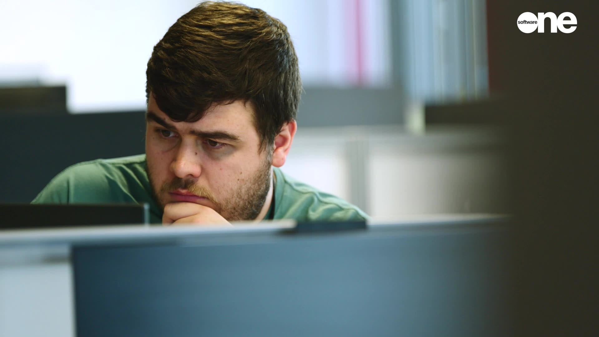 man deep thought computer screen