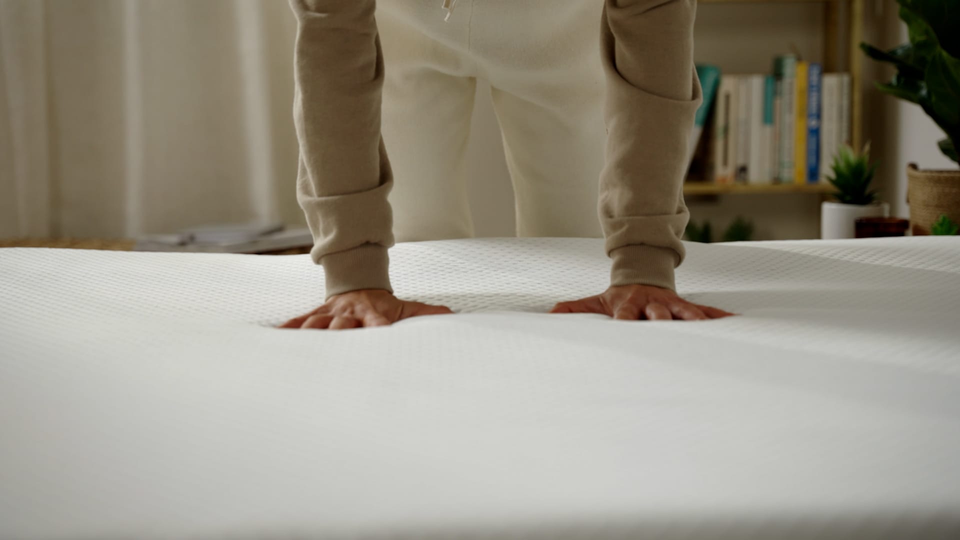 woman hands press mattress